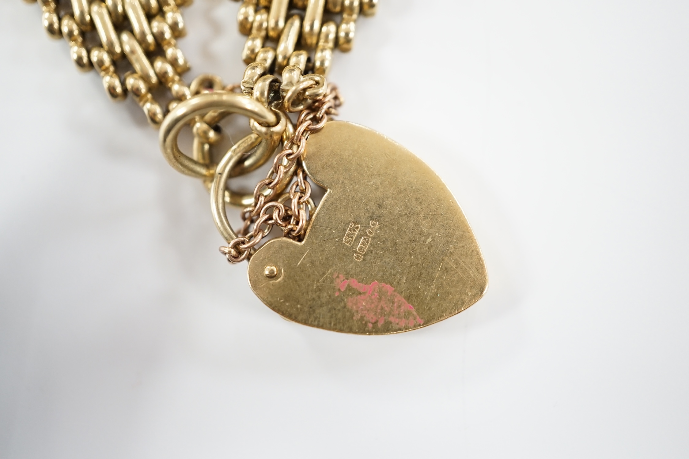 A 1960's 9ct gold gate link bracelet, with heart shaped padlock clasp, 17cm